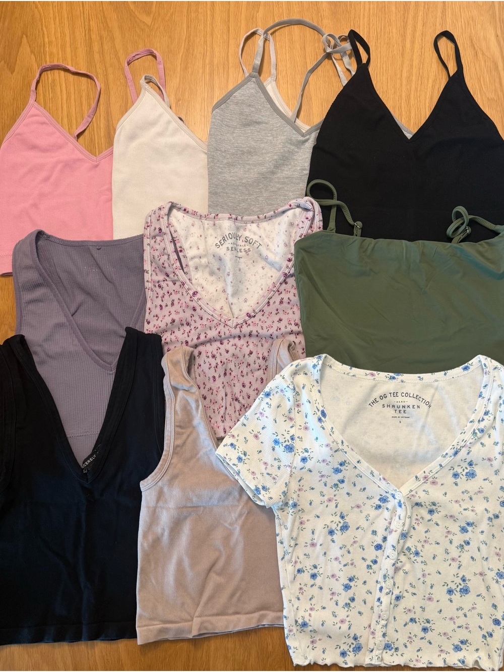Assorted Women's cropped shirts in pink, purple, green, tan, white, grey, &black